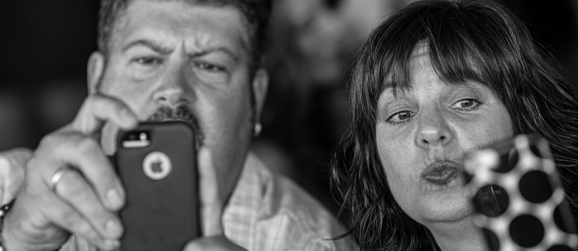 two people looking at their phones