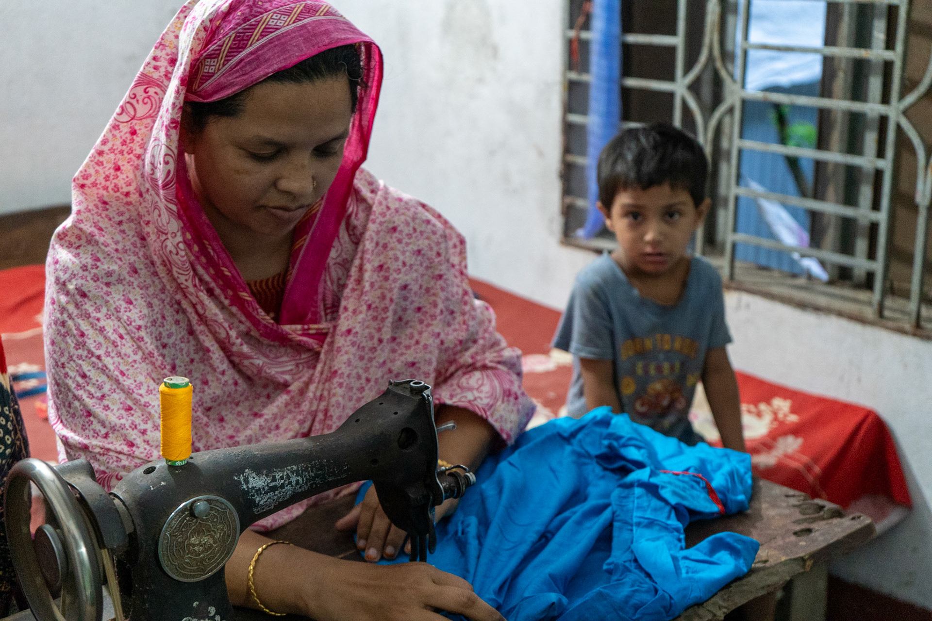 Grameen Bank Borrower shows the sewing business she has built thanks to Grameen Bank loans; Patuakhali, Bangladesh