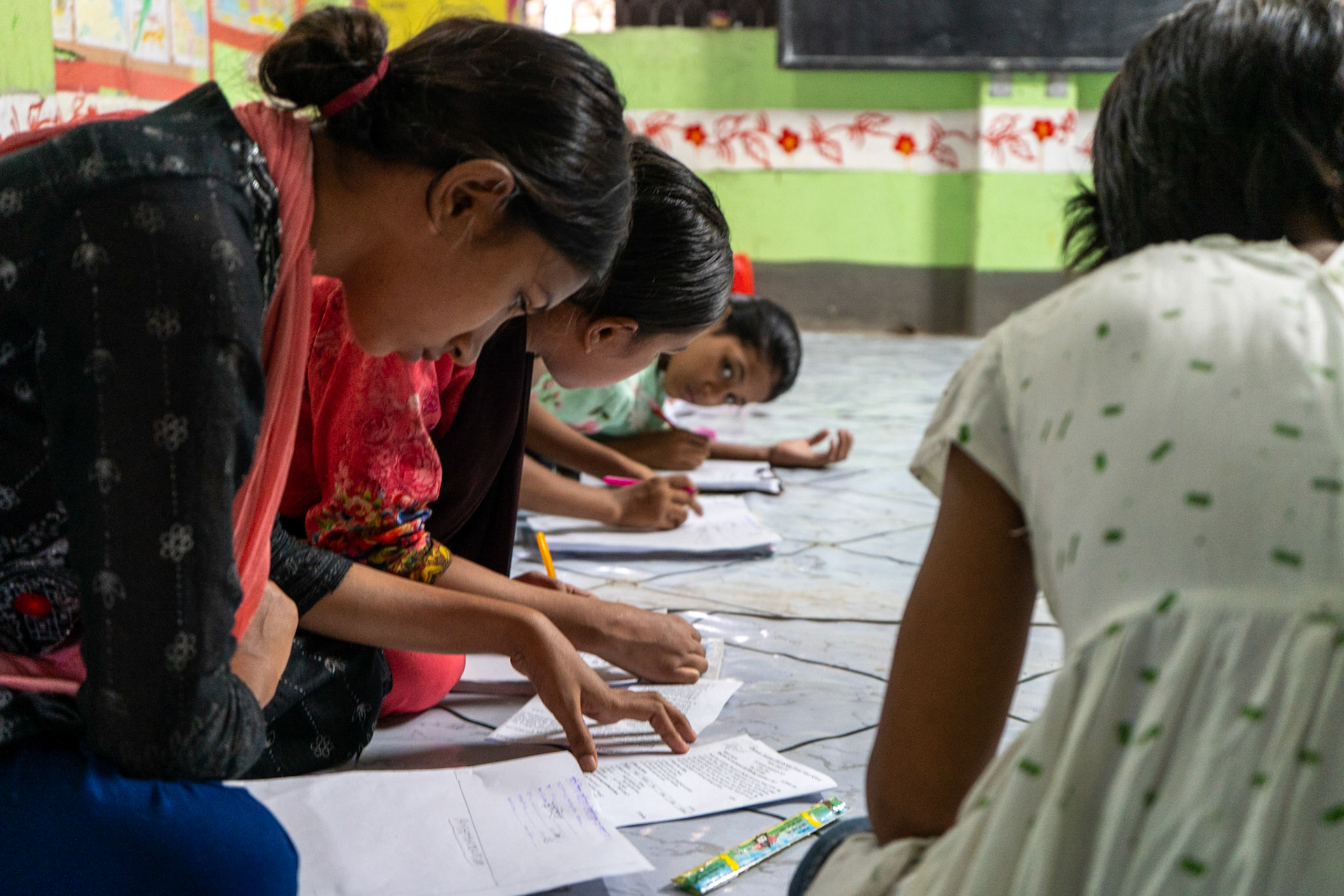 Students at a Grameen Shikkha Slum School take an English exam; Mirpur, Dhaka, Bangladesh