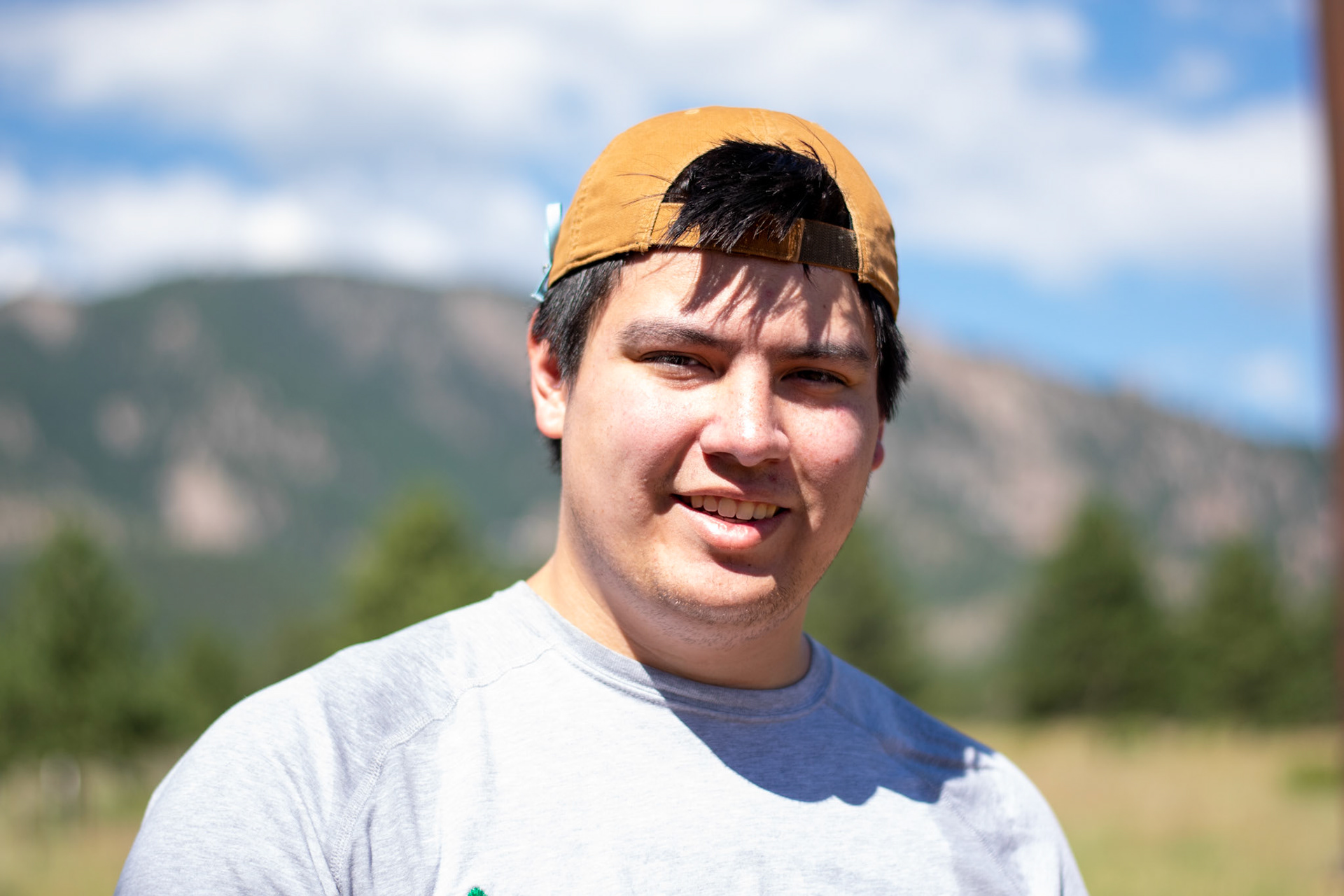Alex with mountains in the background