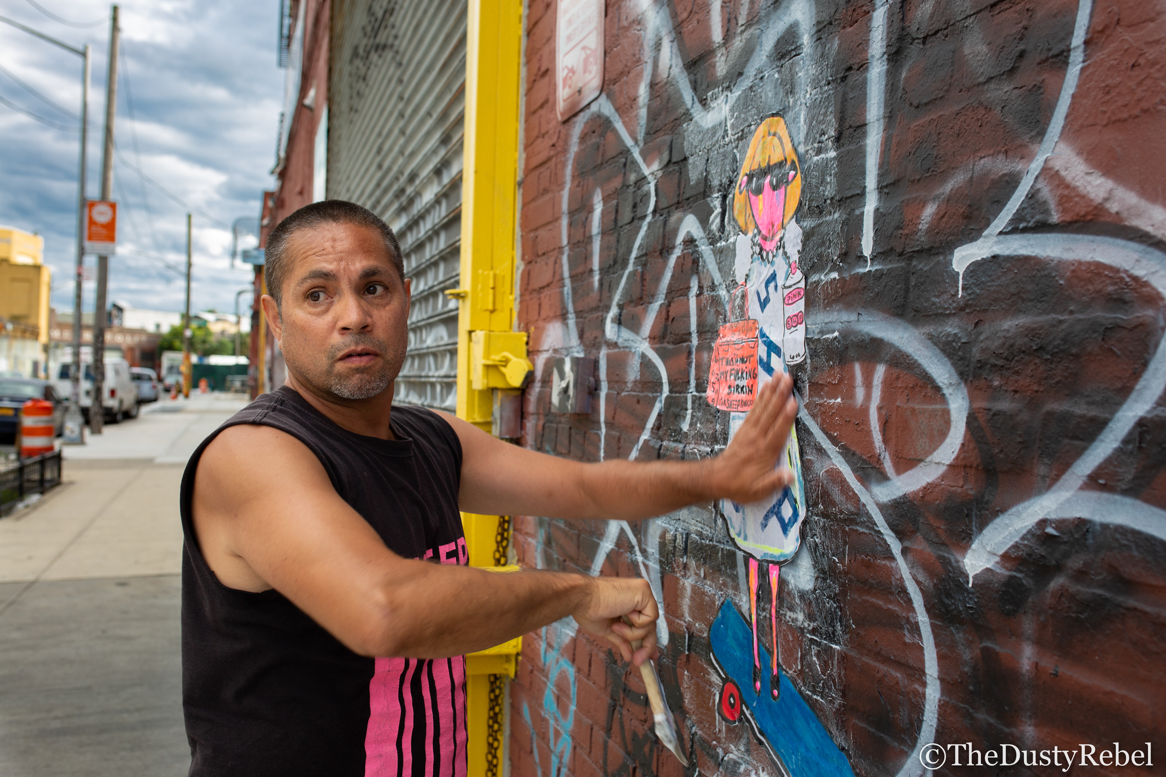 Little Ricky pasting up work in Brooklyn (2019)