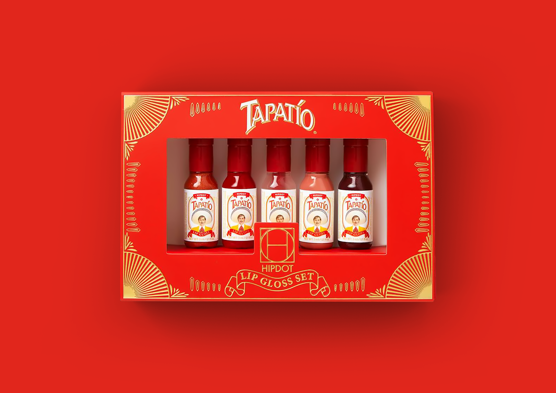 HIPDOT x TAPATÍO makeup packaging with LA DIABLA and EL DORADO pigment palettes, hot sauce bottles and red peppers by Dima Rykov