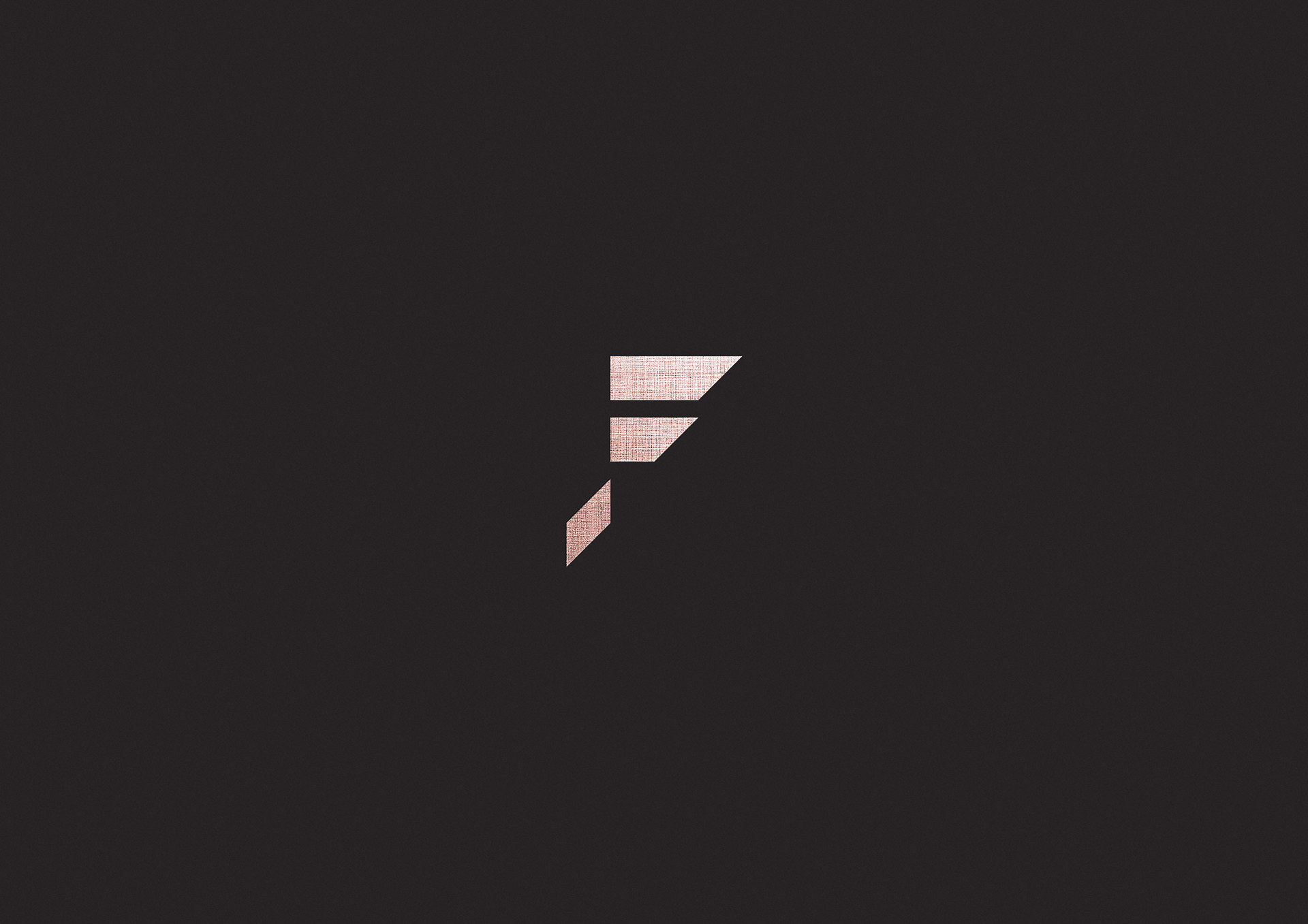 Frisson luxury brand identity featuring the logo and geometric monogram on textured paper by Dima Rykov