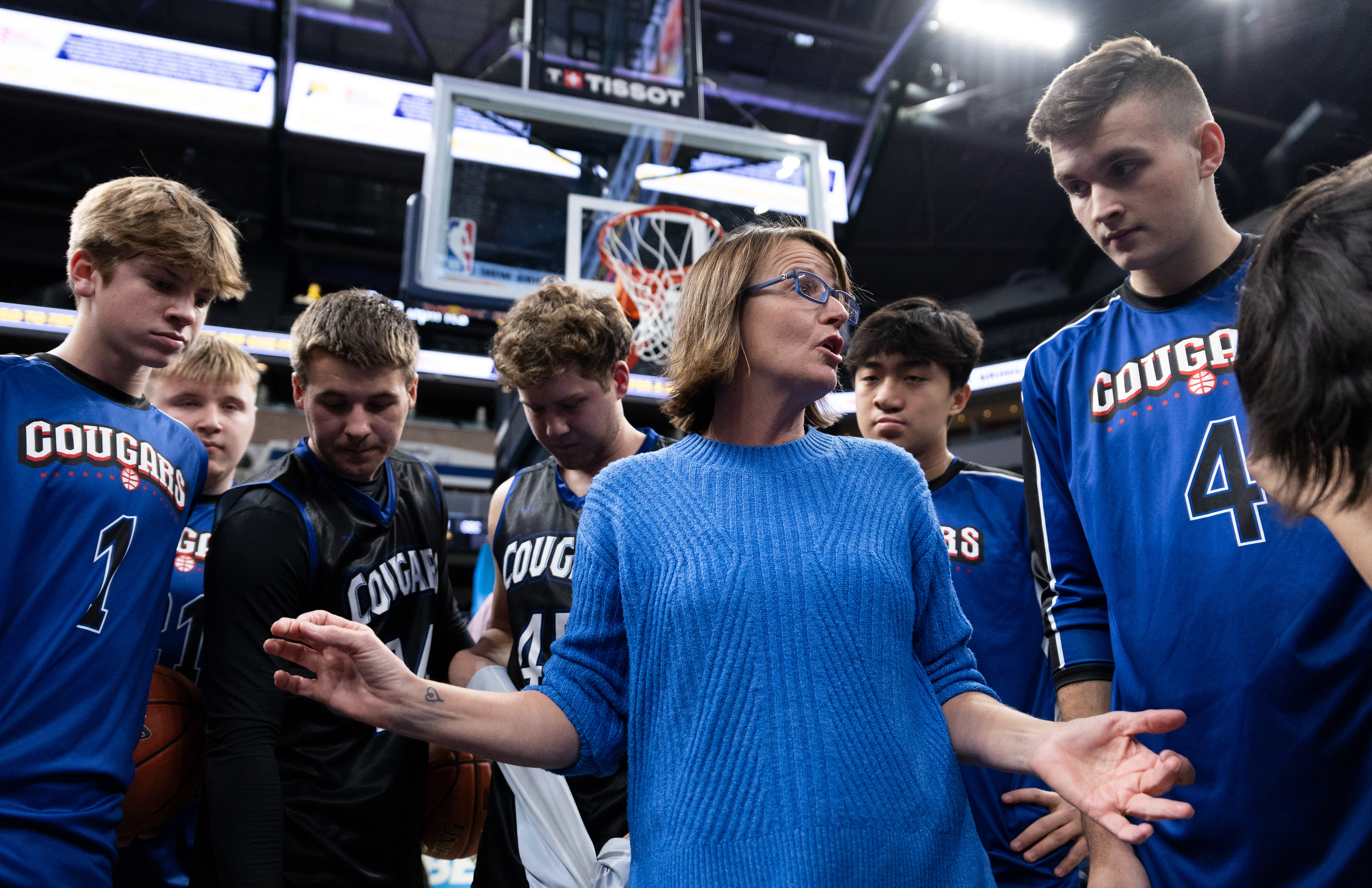 Christian Educational Consortium Cougars head coach Gina Renfro speaks to her varsity team before a matchup against the Whitfield Wildcats in the Gainbridge Fieldhouse on Nov. 27, 2024. The two high school teams had been selected by lottery to play in the Gainbridge Fieldhouse after an Indiana Pacers game.