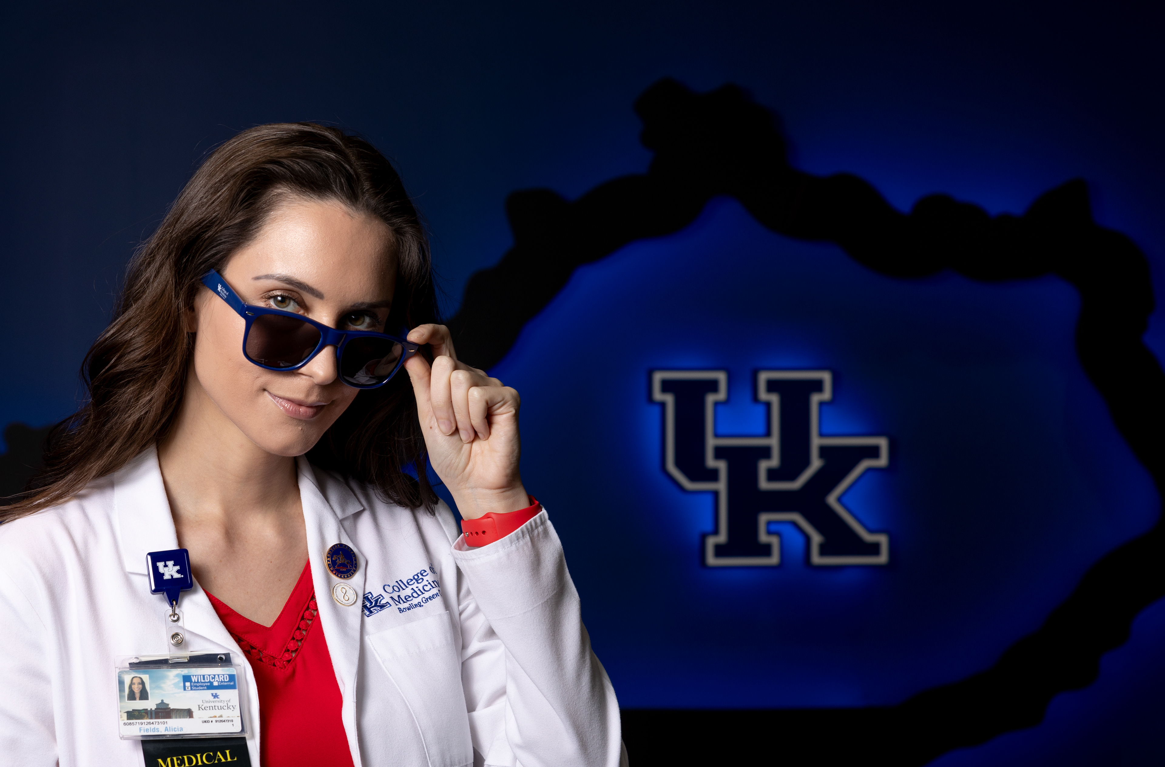 Graduate student Alicia Fields, head of the Sun Protection Outreach Teaching by Students program, shows off University of Kentucky themed sunglasses in the University of Kentucky College of Medicine in Bowling Green, Ky., on Feb. 27, 2024. Fields and her team have always handed out the sunglasses to students in the classrooms of the schools they present at in the wider Bowling Green community.