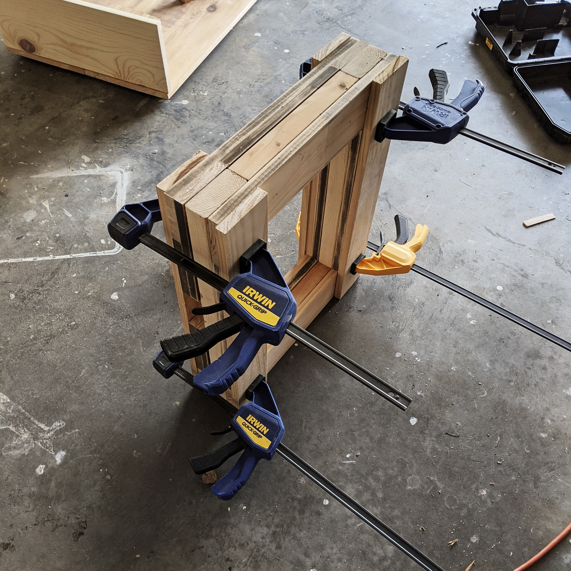 Slapping more scrap wood together to bulk up the legs.