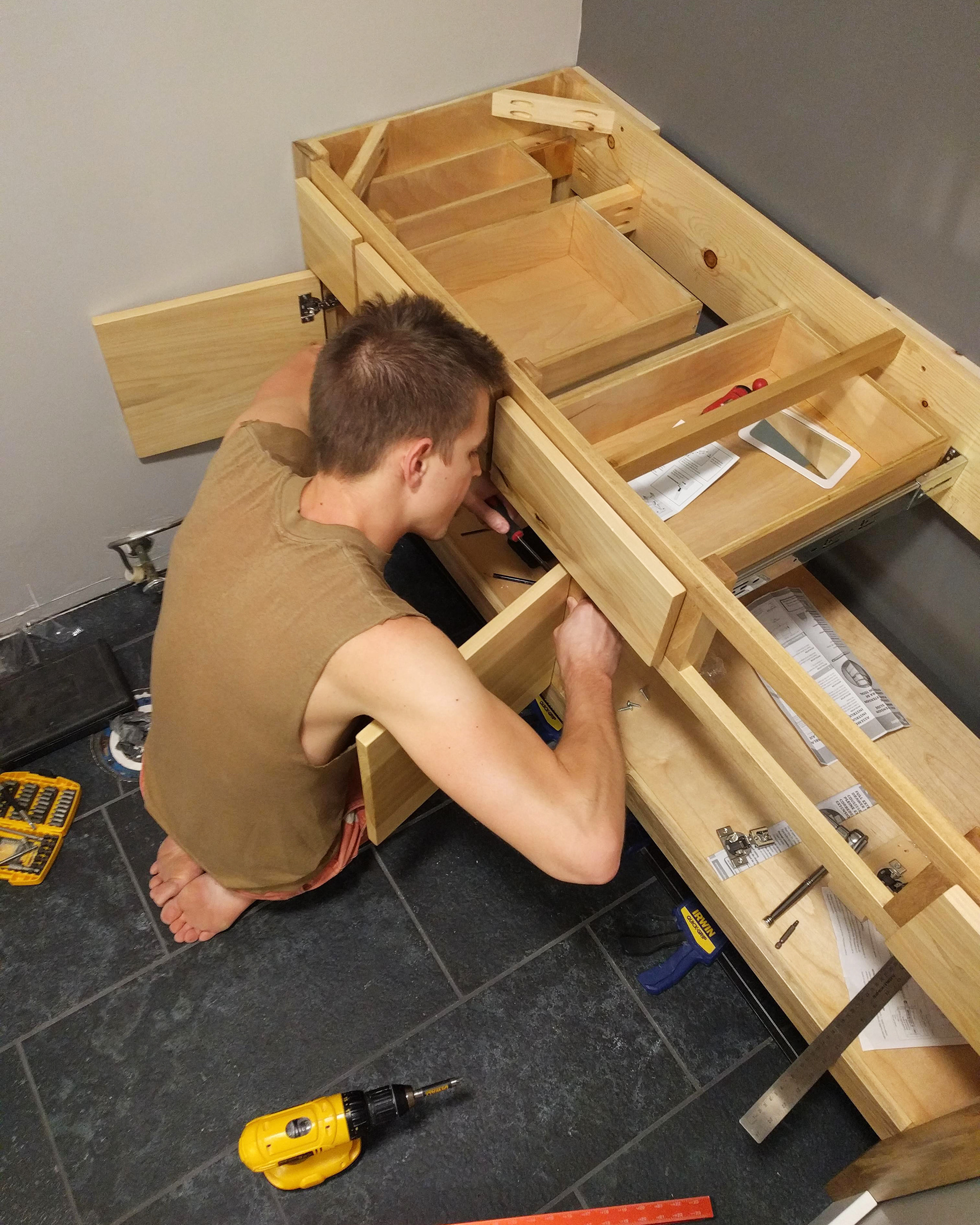 Installing hinges and slides.