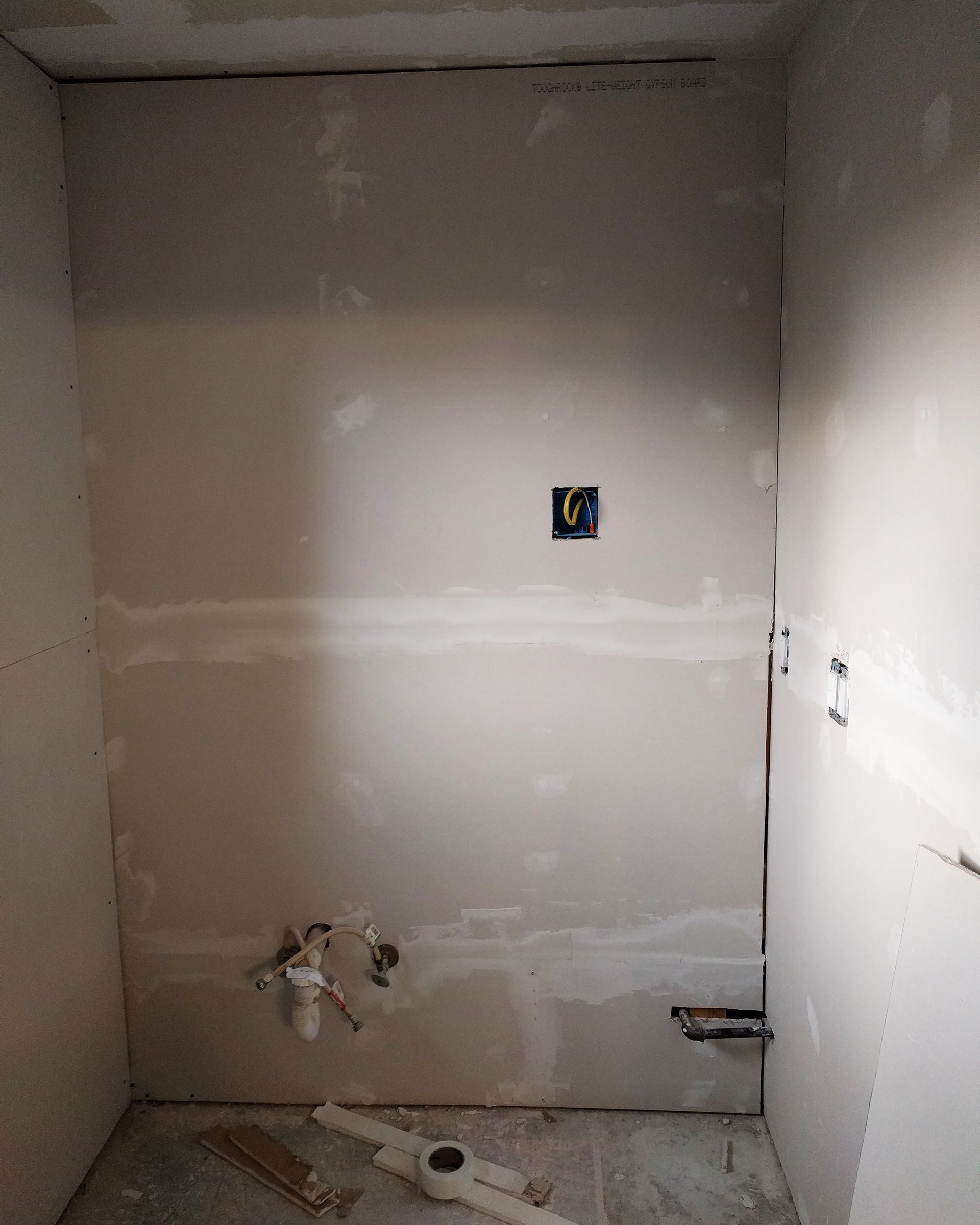 Hanging drywall.