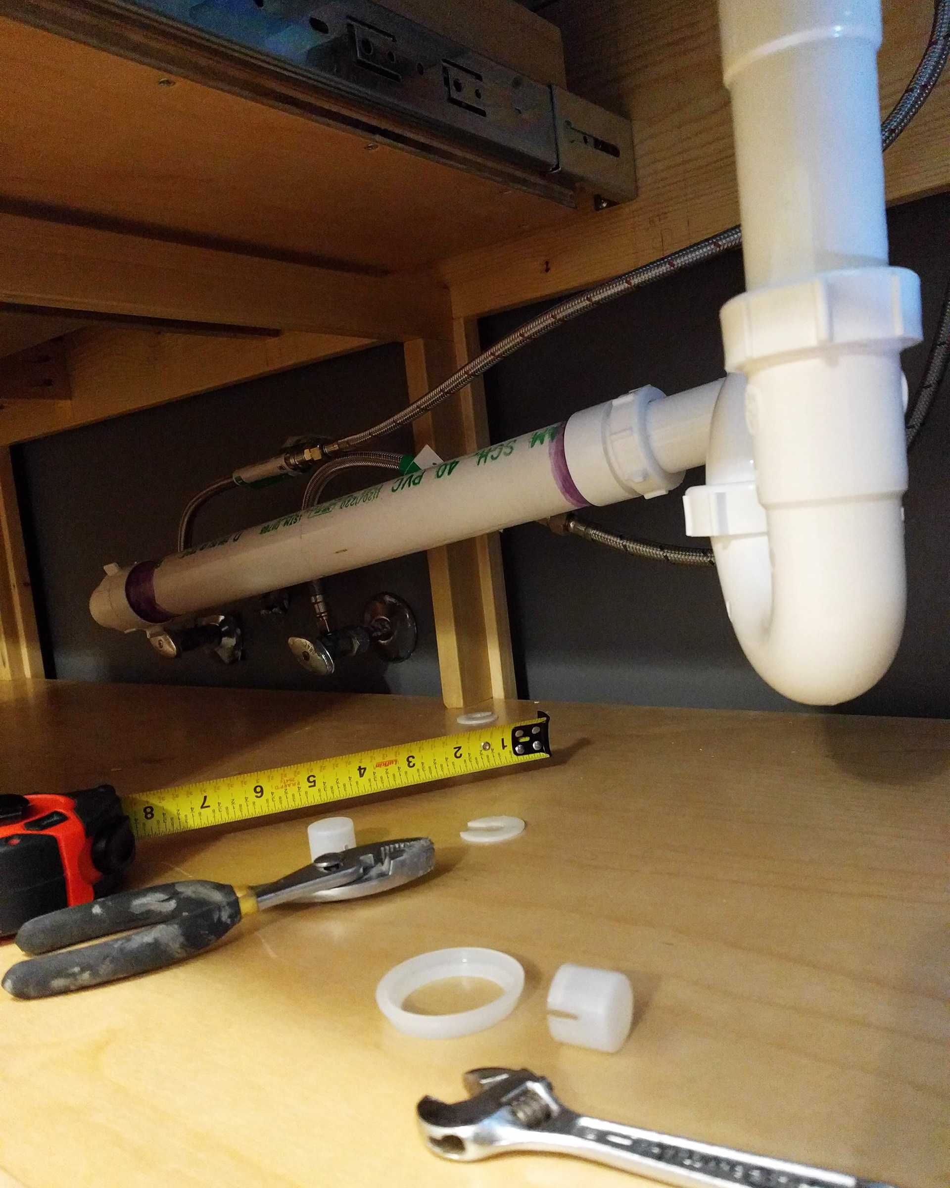Installing the plumbing for the sink.