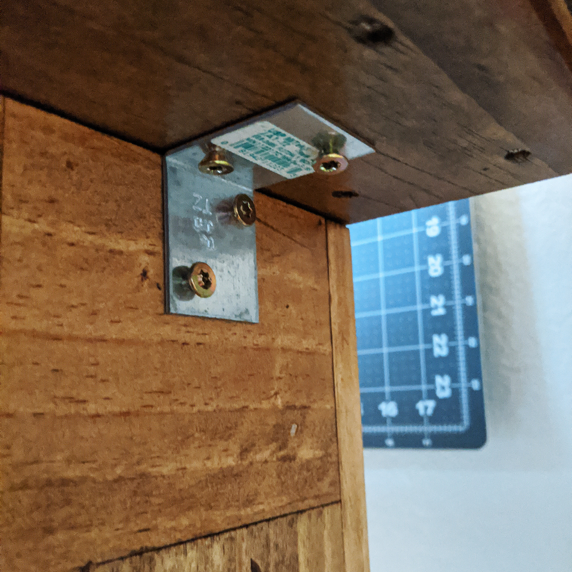 Top secured to the legs with super fancy brackets.