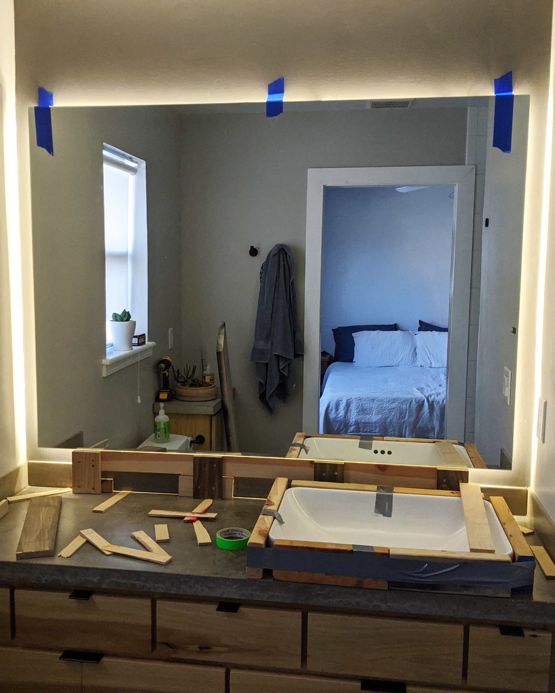 Hanging the mirror.
