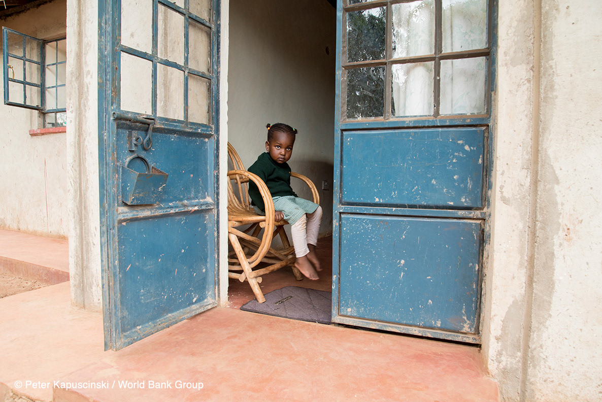 A child rests after a long day of school near Kisumu, Kenya. Photo: Peter Kapuscinski / World Bank