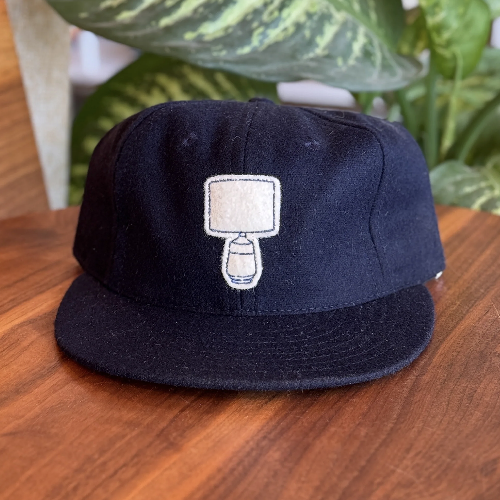Navy wool, felt w/emb.
