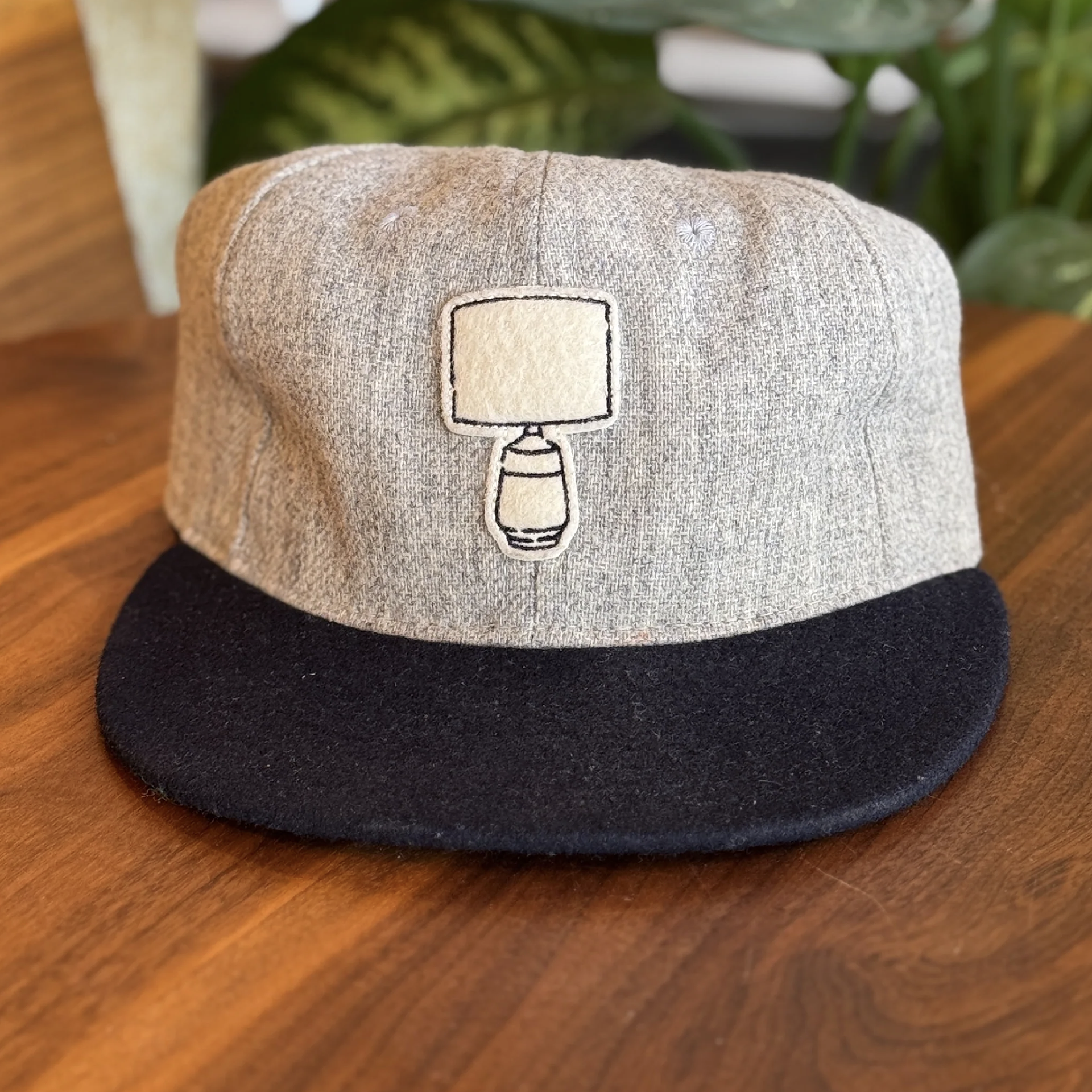 Light gray wool, felt w/emb.