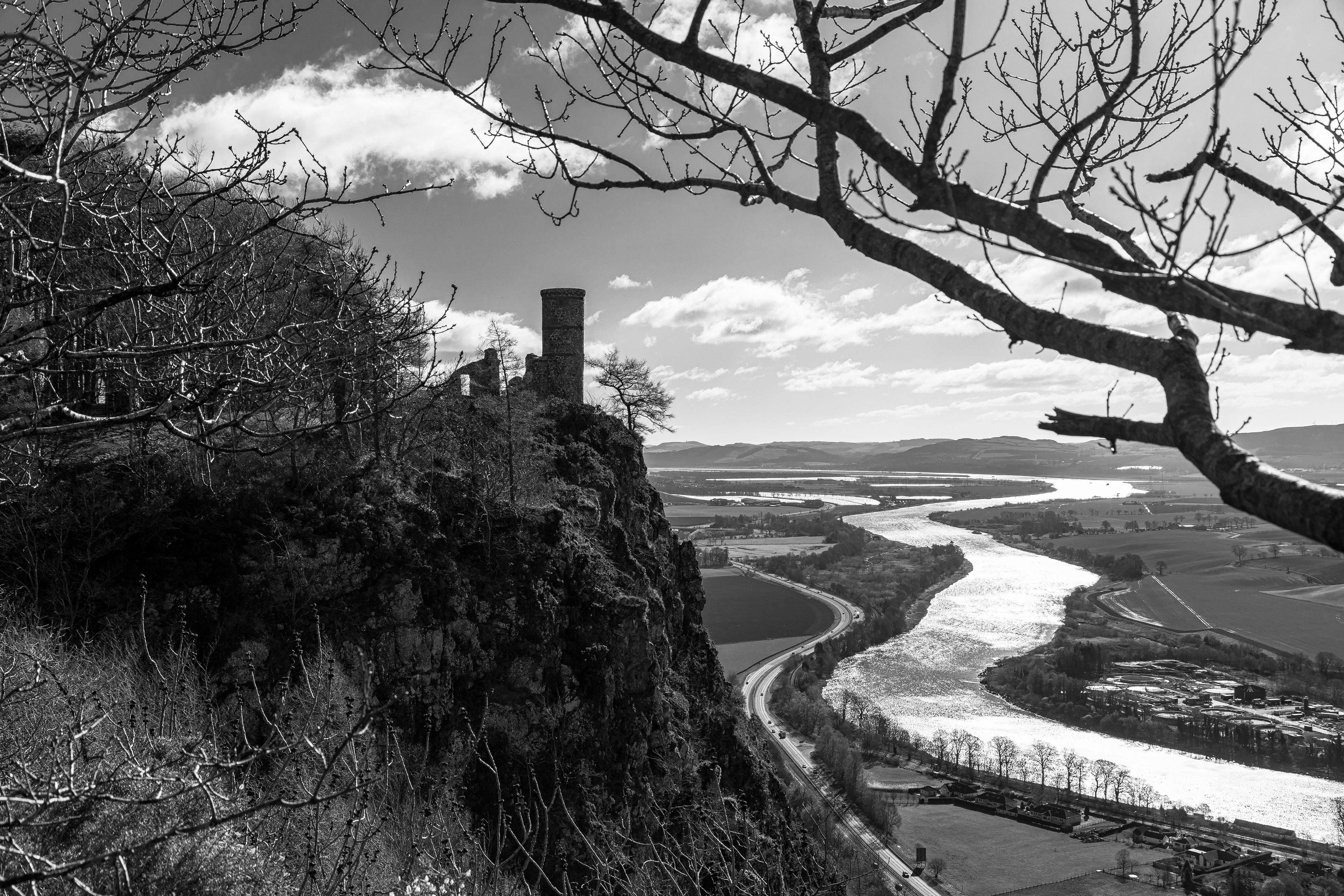 Black and white shot of the Folly tower on Kinnoull Hill with the River Tay 