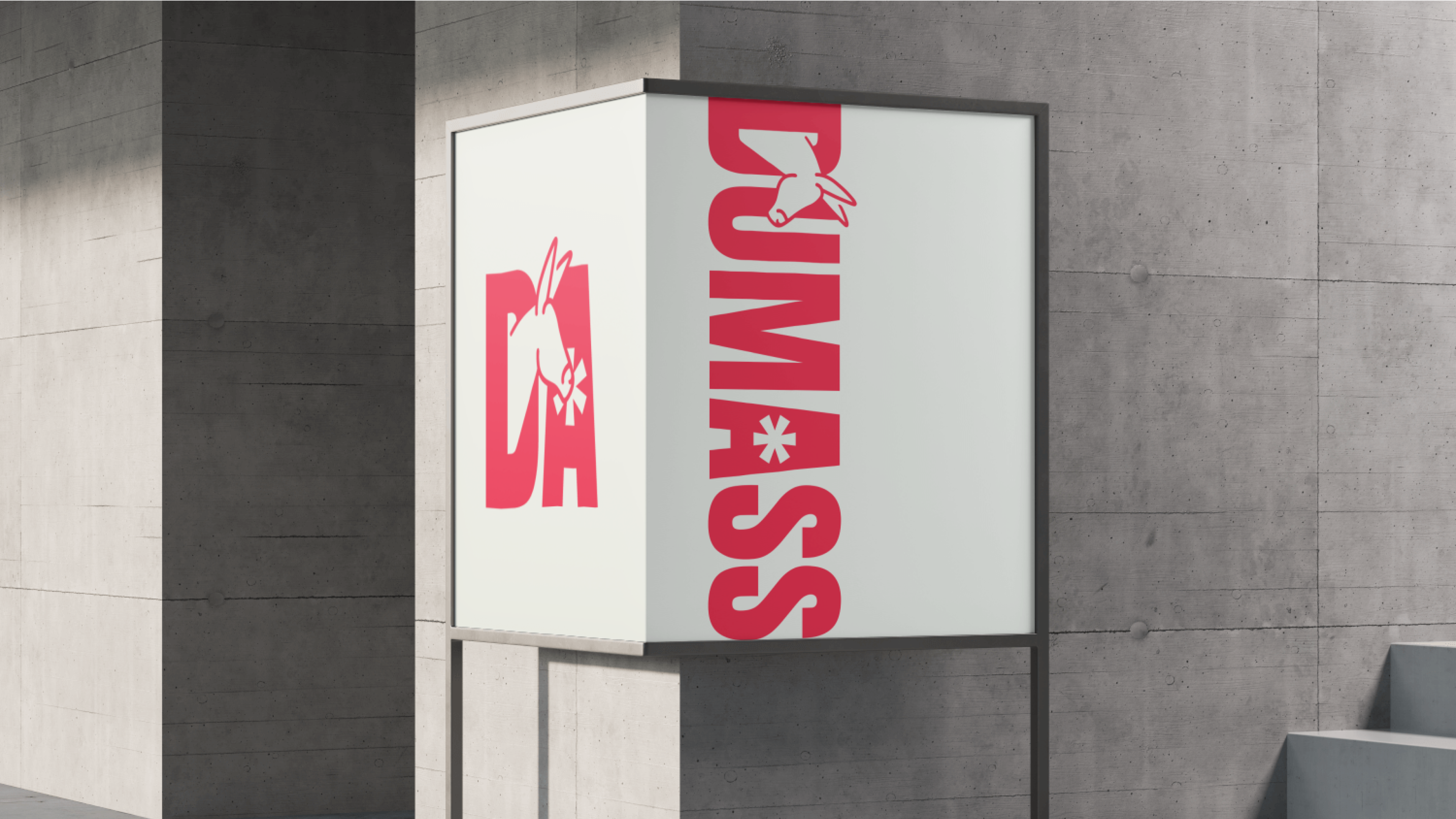 Outdoor signage featuring the 'DUMASS' logo on a sleek white box mounted against a concrete wall, showcasing the brand's bold visual identity in an urban setting.