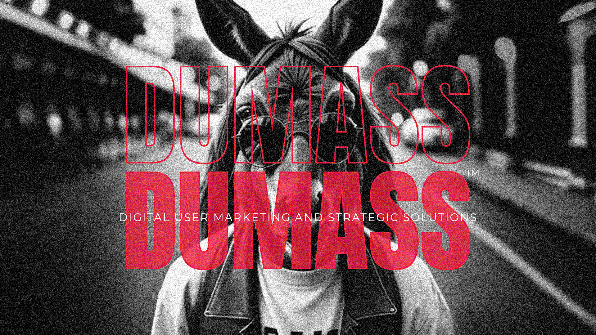 Grayscale image of a person wearing a donkey mask, with bold red 'DUMASS' text overlay and subheading 'Digital User Marketing and Strategic Solutions,' symbolizing the brand's playful and out-of-the-box approach.
