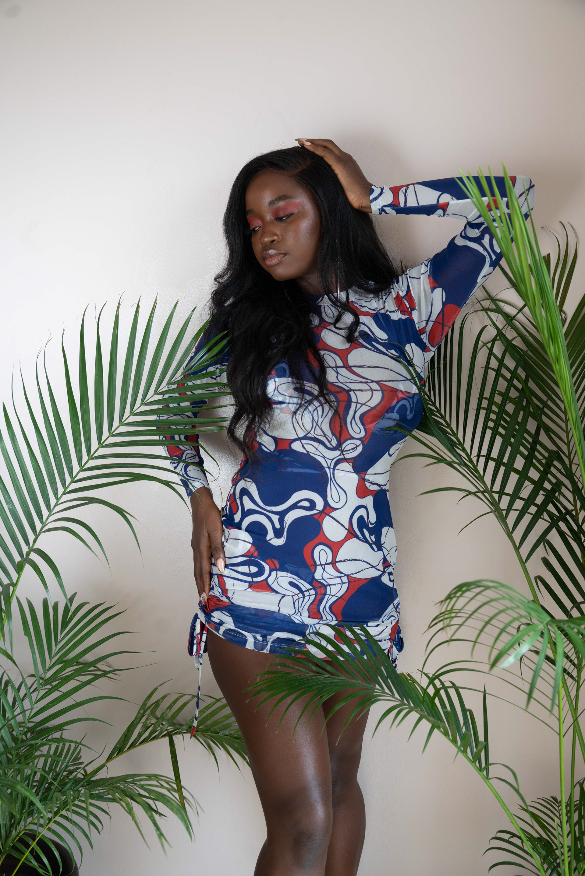 woman wearing a printed swimsuit short dress