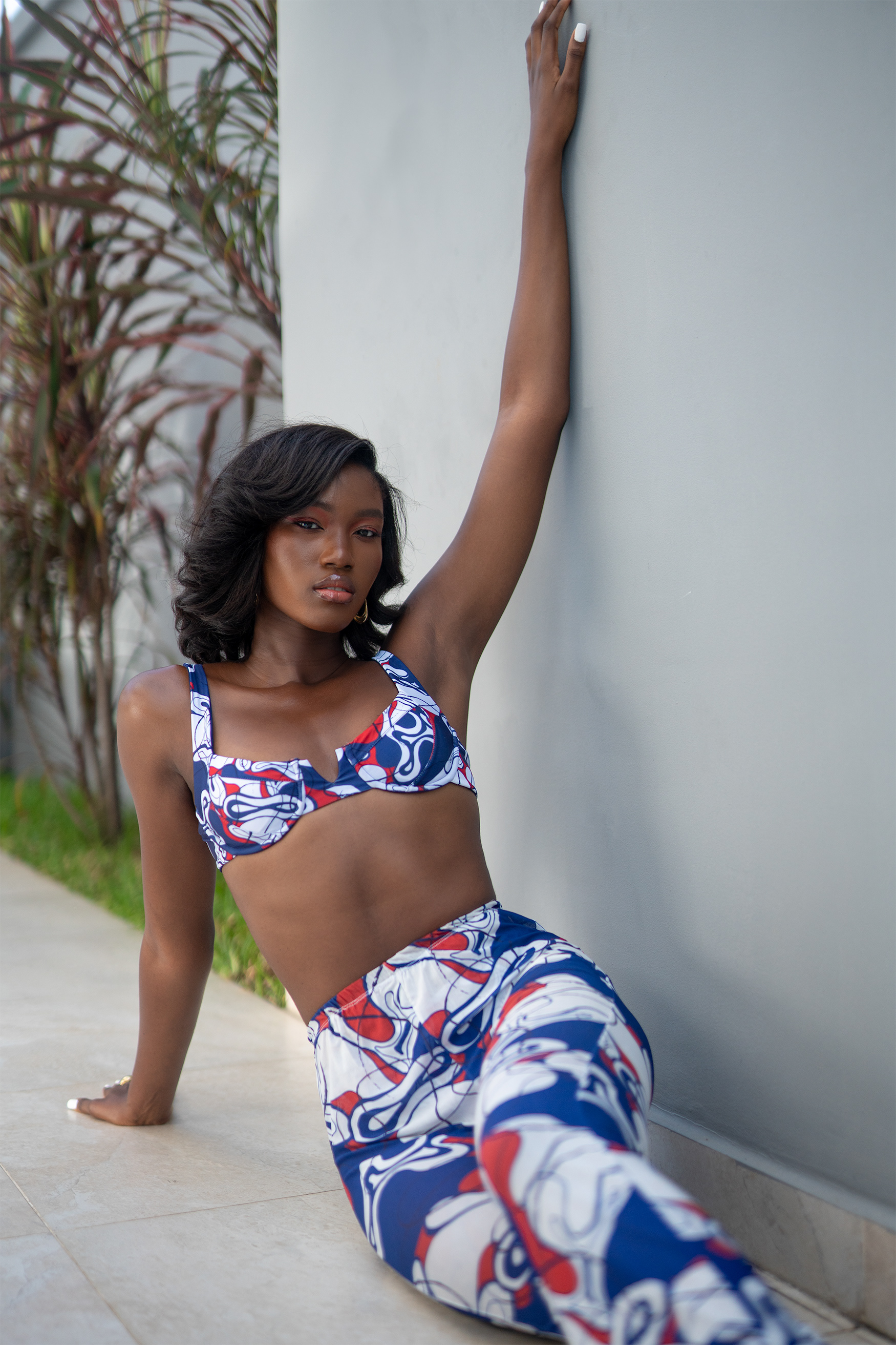 woman wearing a bikini top and pants, both printed with the same pattern design