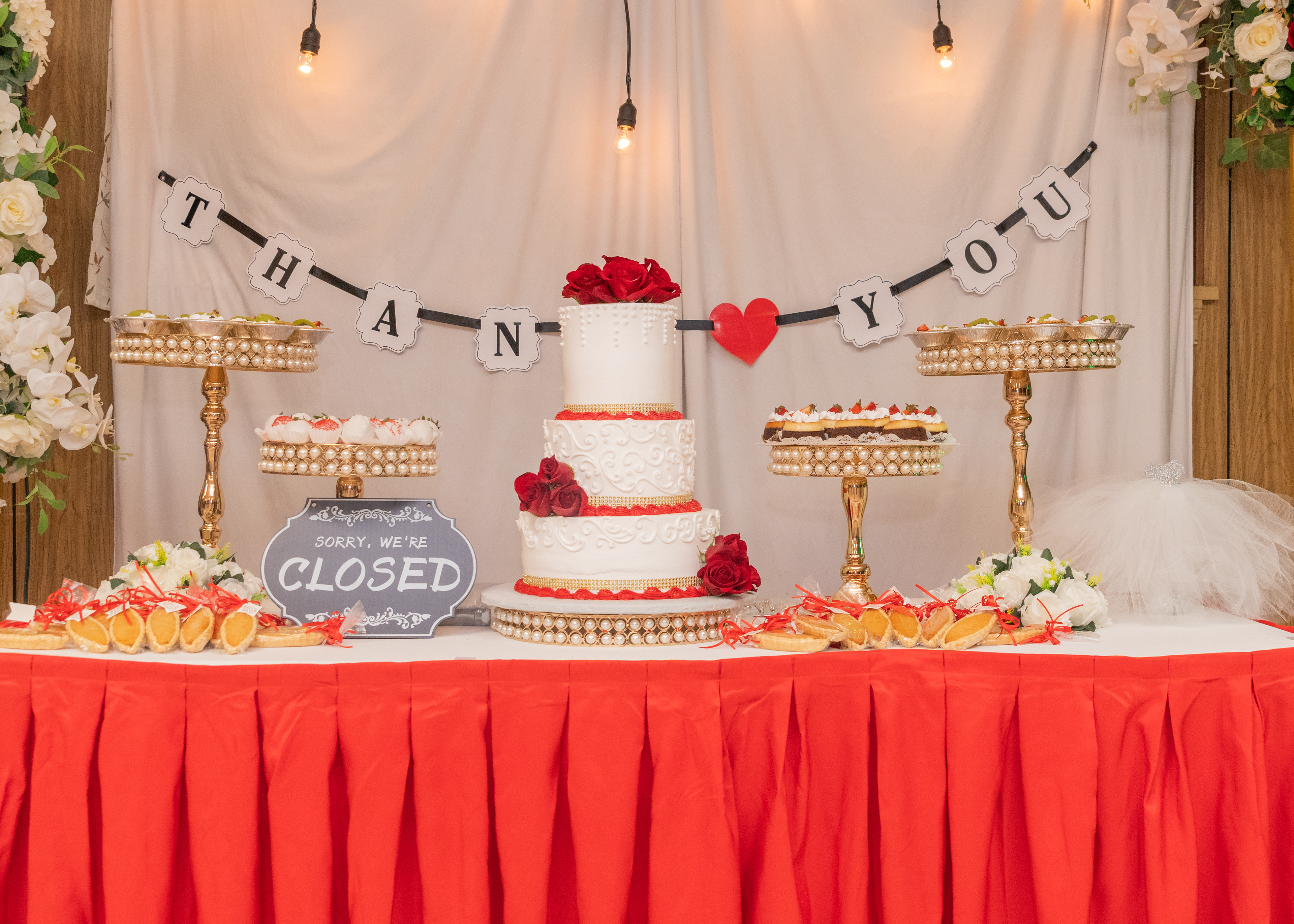 Wedding cake & other desserts on table at Reception in Waukegan, IL