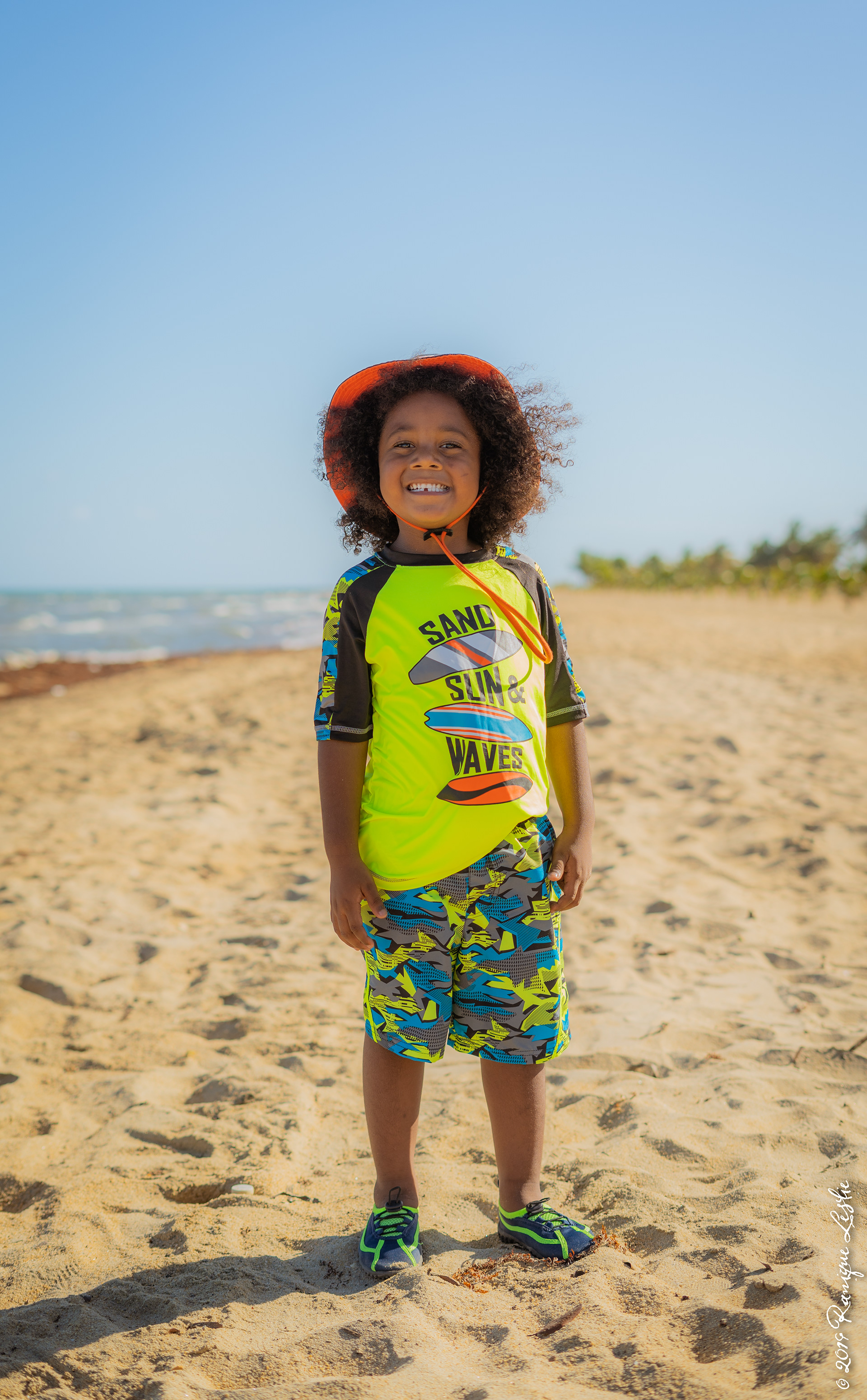 Kid smiling at the beach