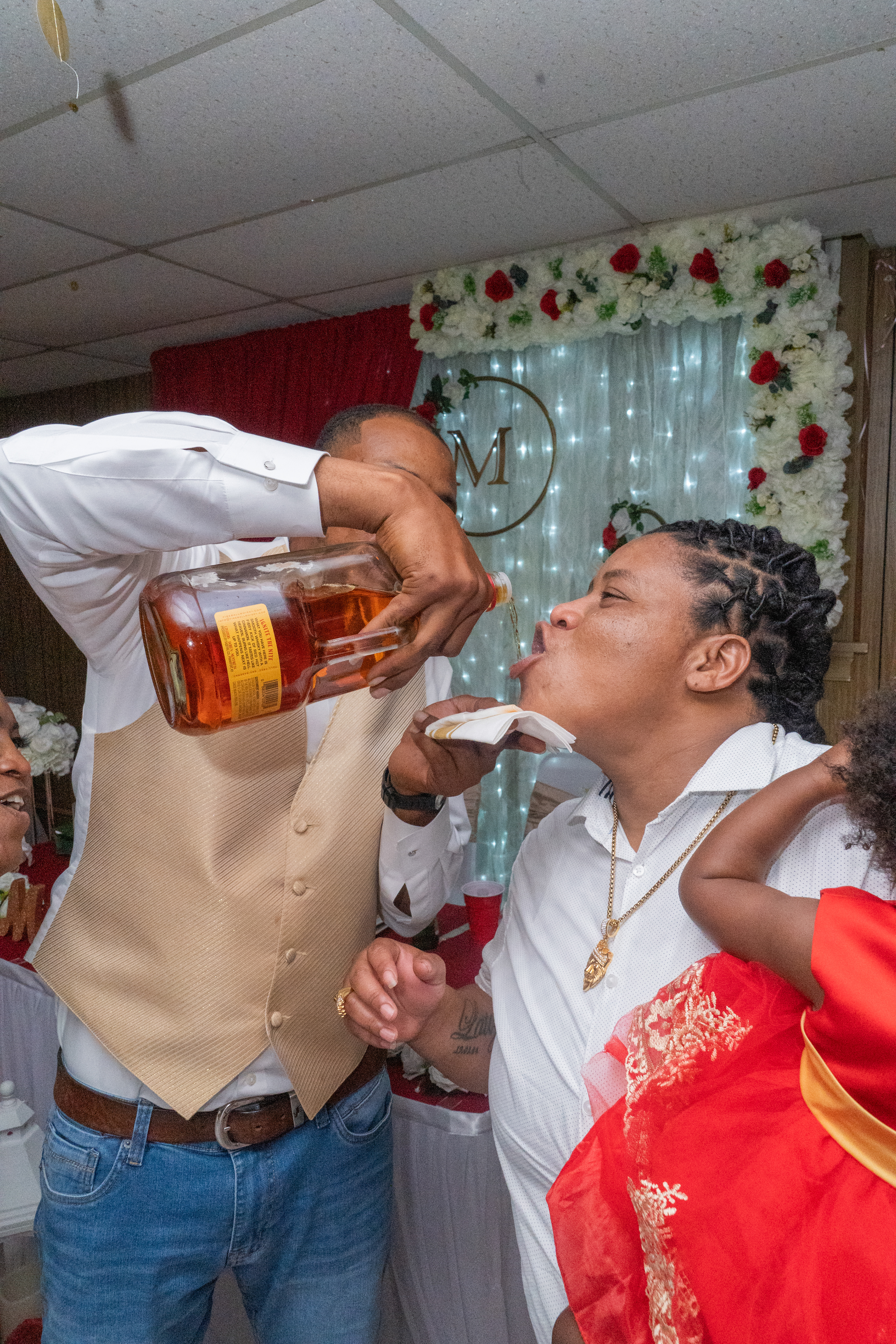 Groom taking a drink at Reception in Waukegan, IL