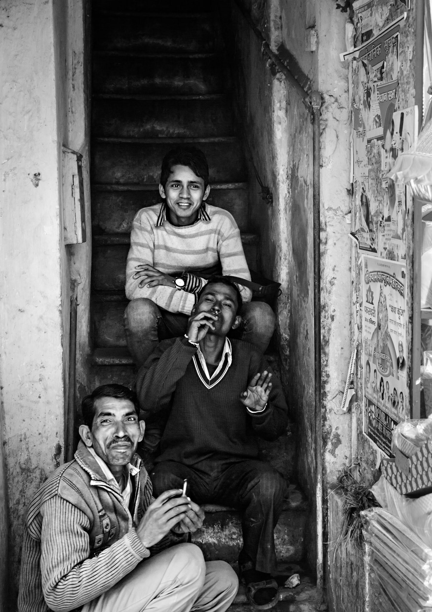 friends hanging out in a narrow stair well