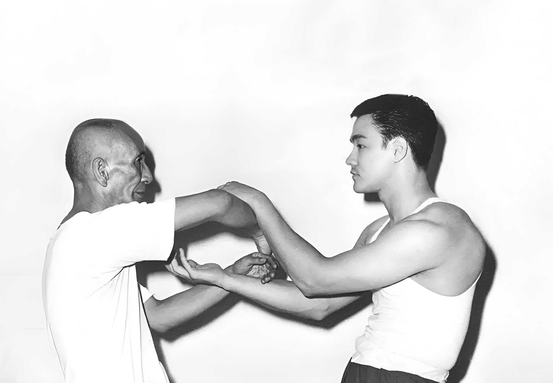 Ip Man and Bruce Lee training chi sao (Circa 1950s)