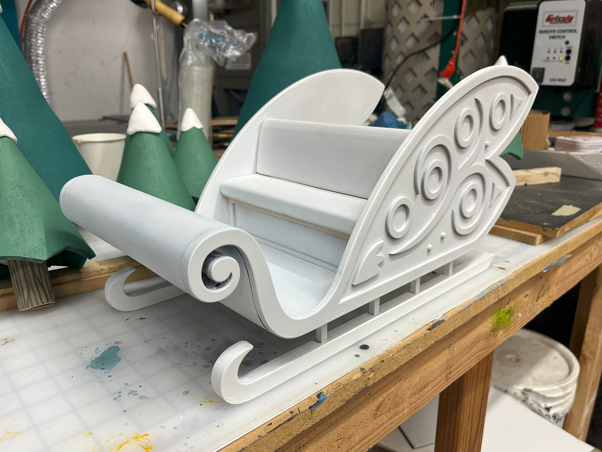 Sleigh, assembled before painting, built from both hand made and lasercut pieces.