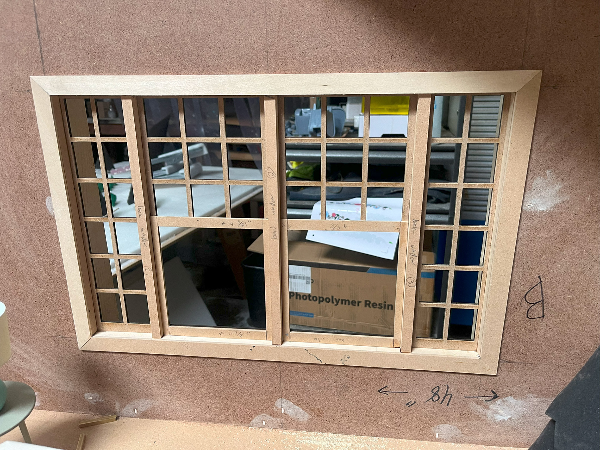 Window and wall, built from both hand made and laser cut components.
