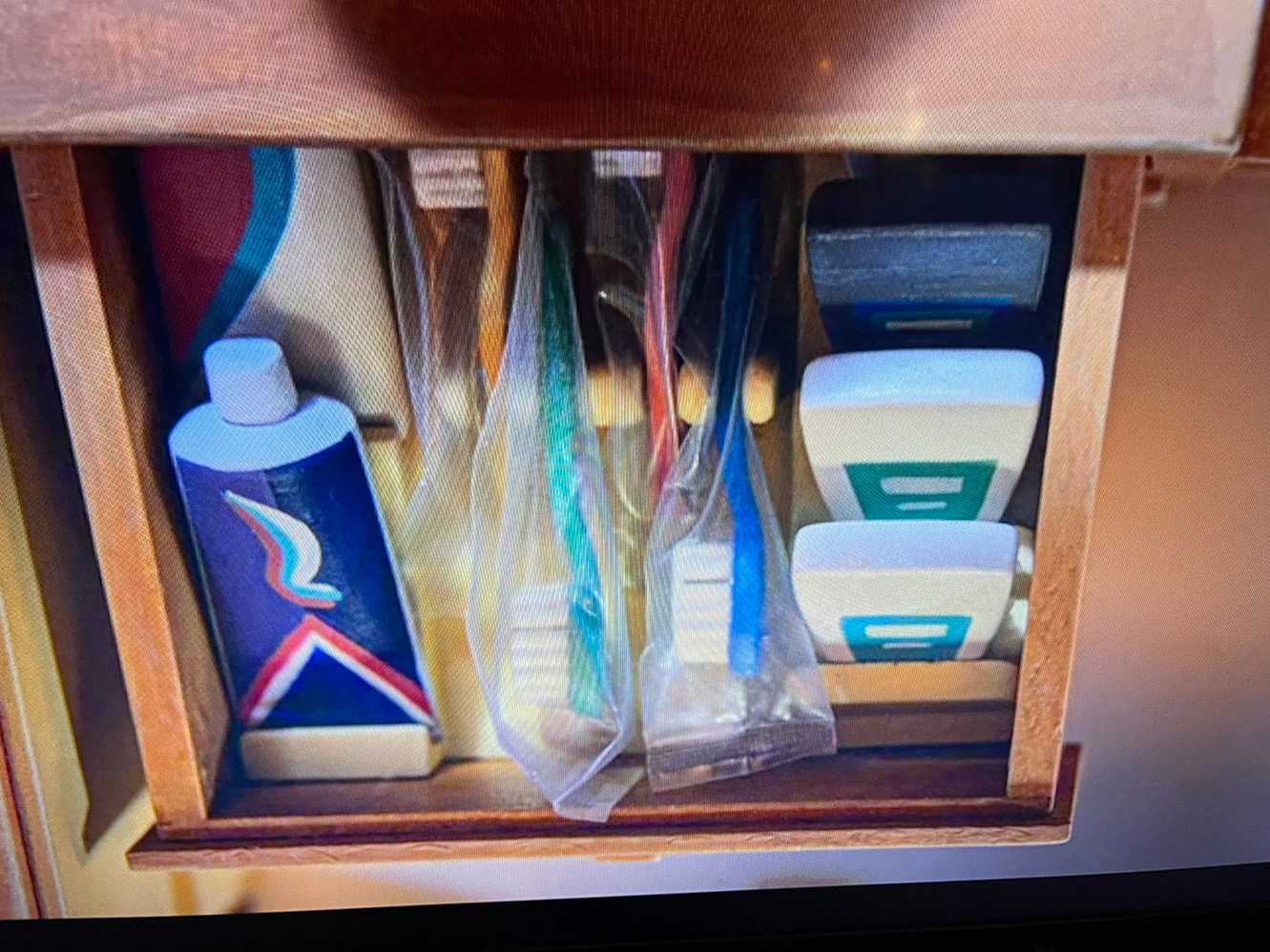 make floss, toothpaste, toothbrush wrappers, and drawer organizer
