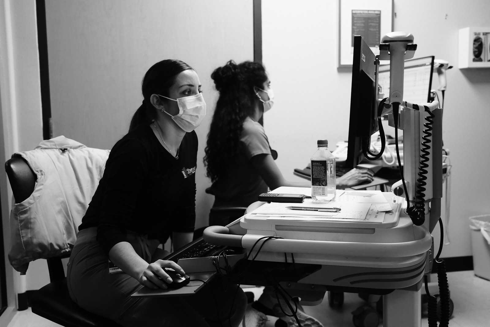 Triage nurses triaging patients.