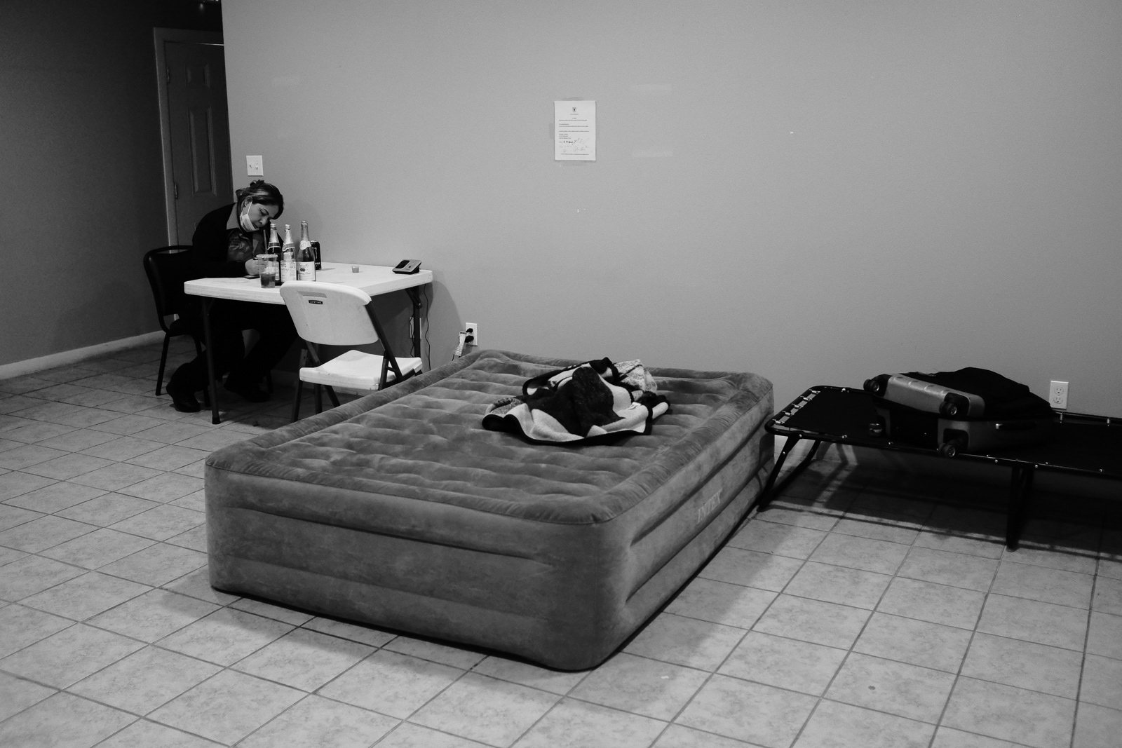 Sleeping quarters in the dinner room area of a apartment that has been converted to an EMS station.