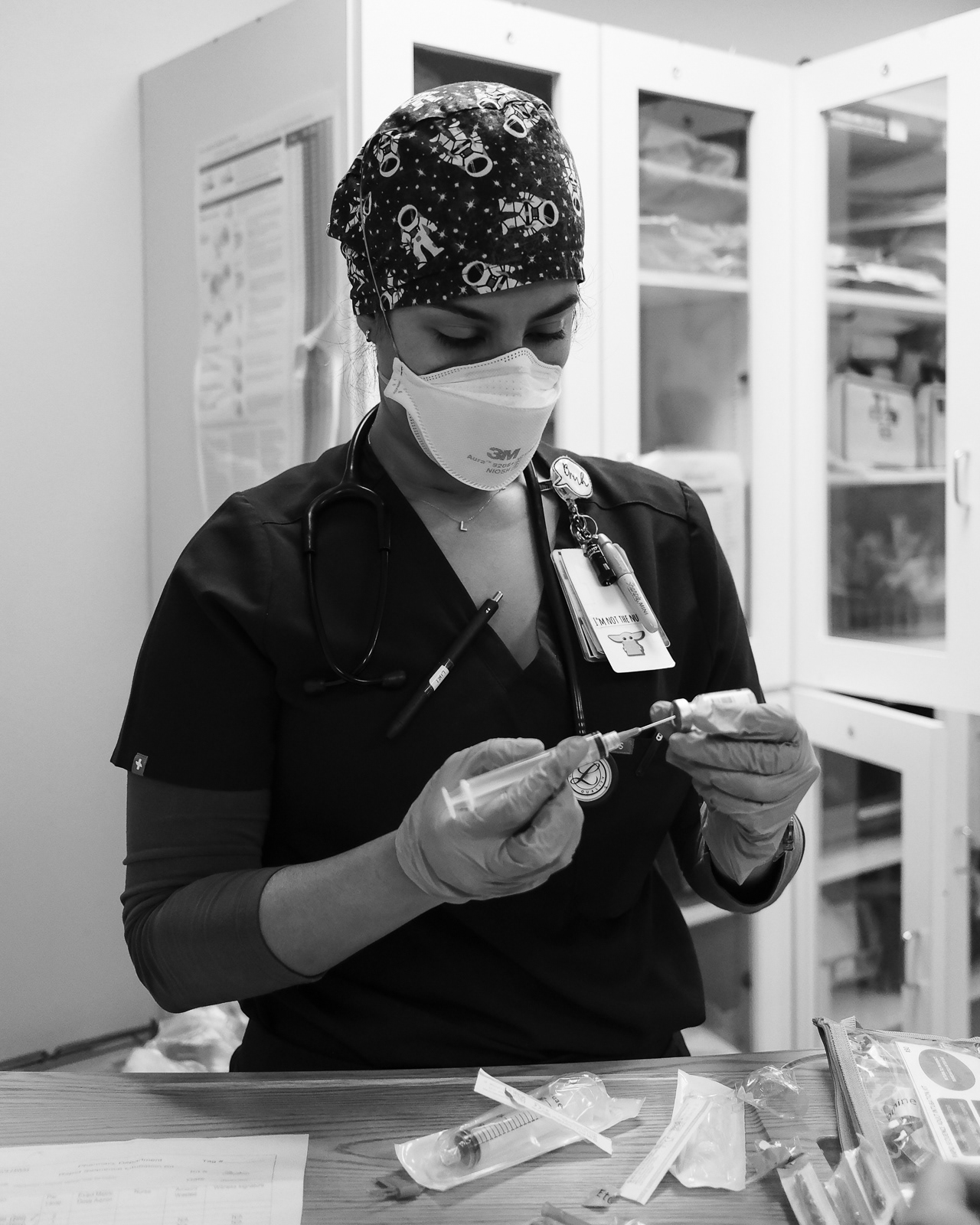 Nurse Lirisbet prepares RSI medication for the Doctor, who has decided to intubate a patient.