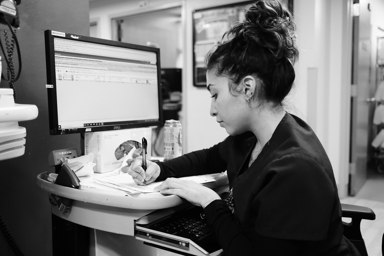 Nurse Dulce, RN, charting her trauma patient.