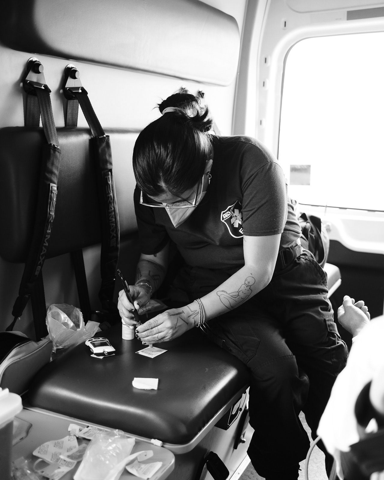 She checks the glucose level of the patient.