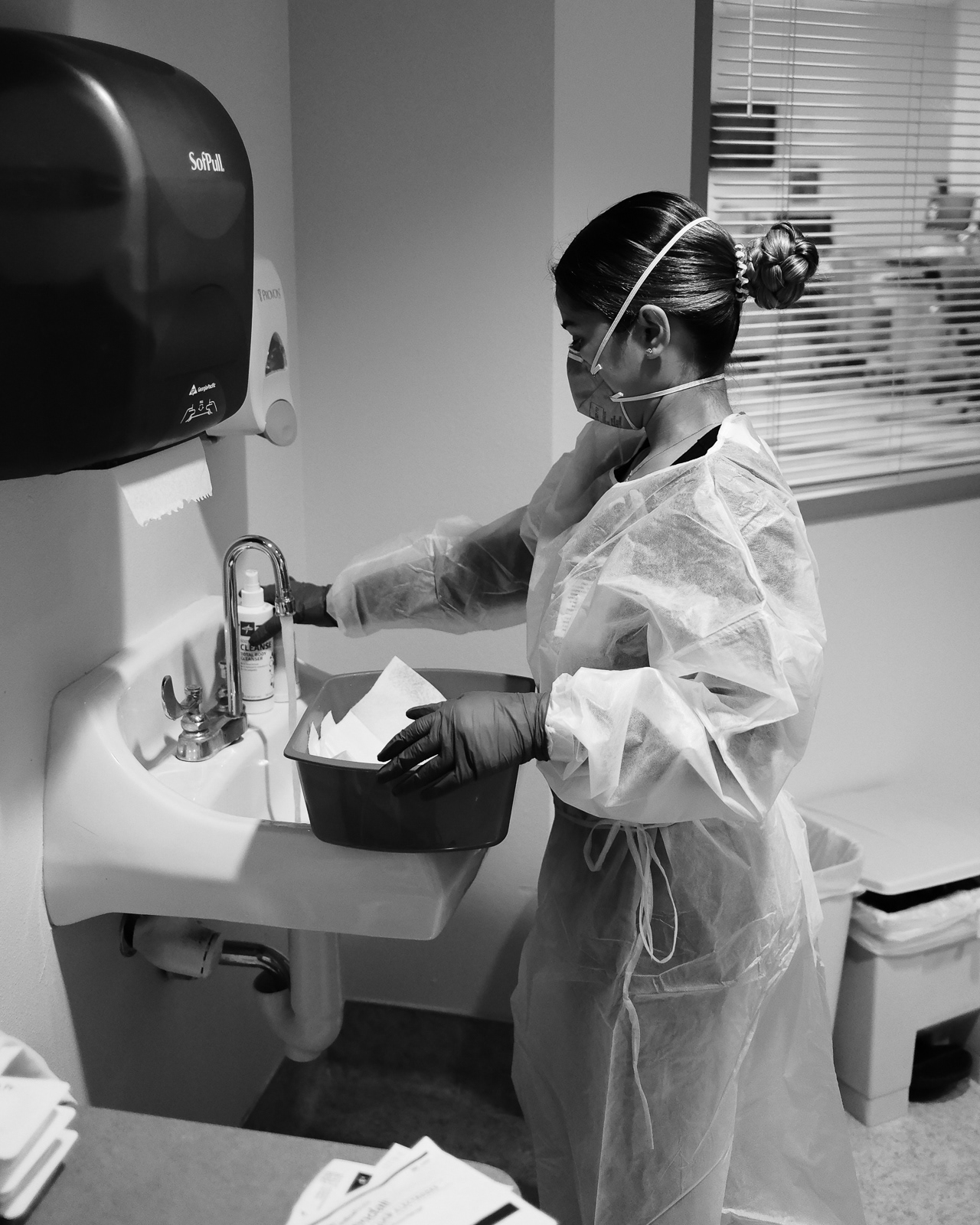 She prepares the items necessary to properly bathe patients