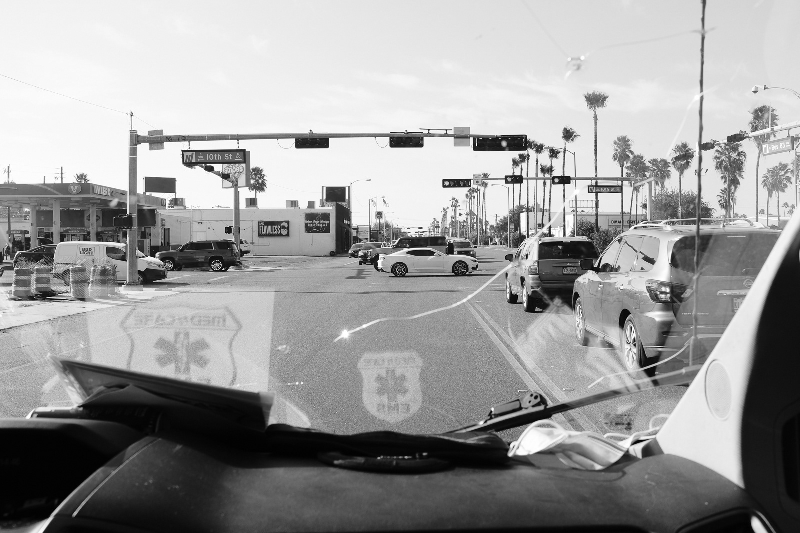 Coming up to the traffic light with lights and sirens on. Today is not the day we get hit.