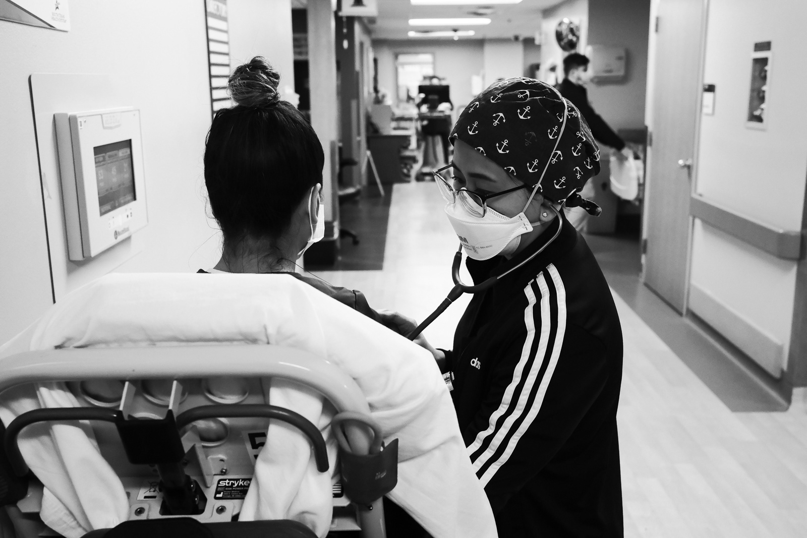 PA Judith assessing the lungs of a patient at the EMS line.