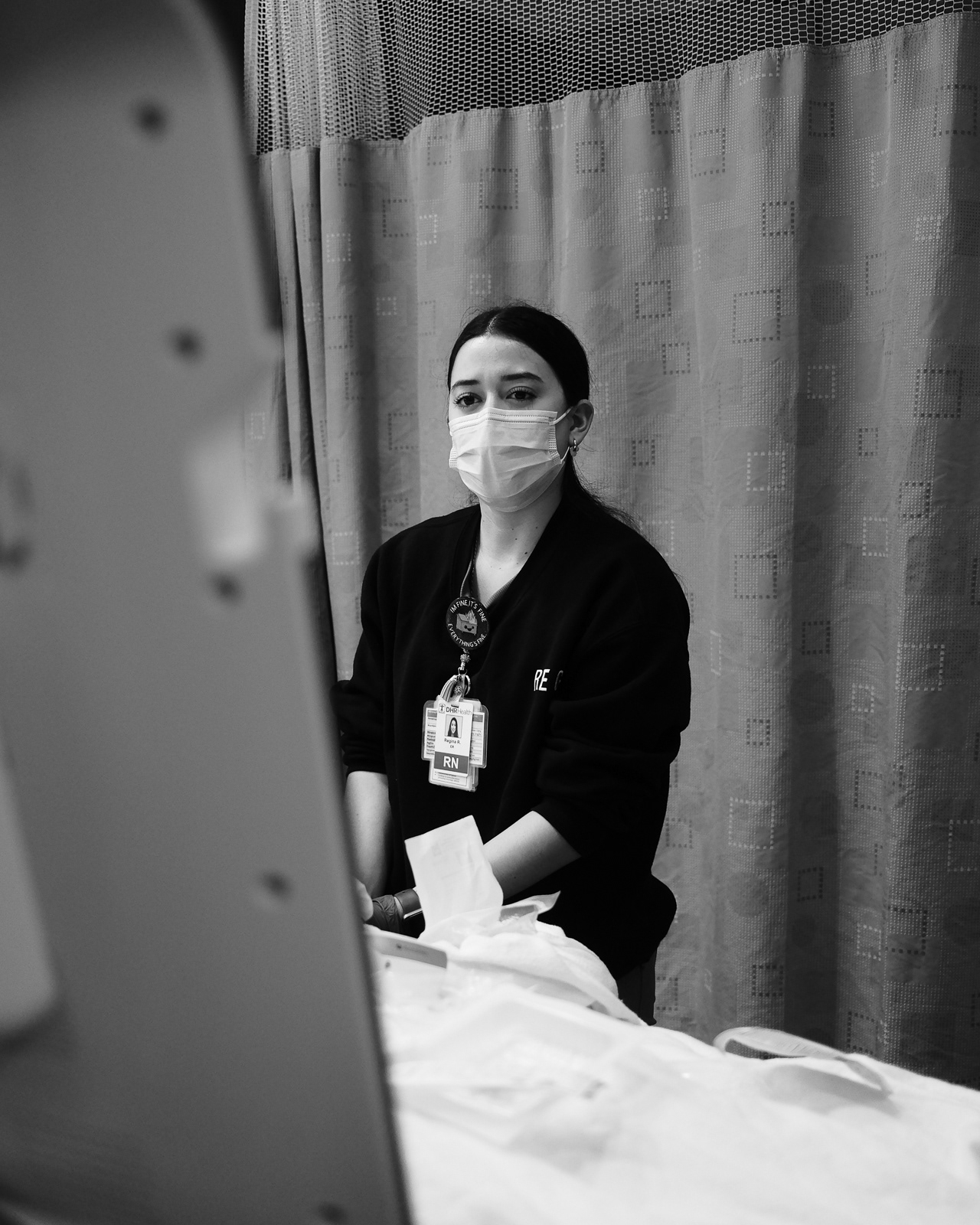 Regi attempting to find a vein using ultrasound machine at bedside. She recently learned how to use it.