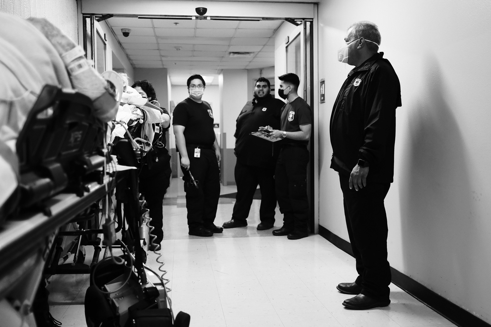 An EMS gatheing while waiting at the front doory of the ER.
