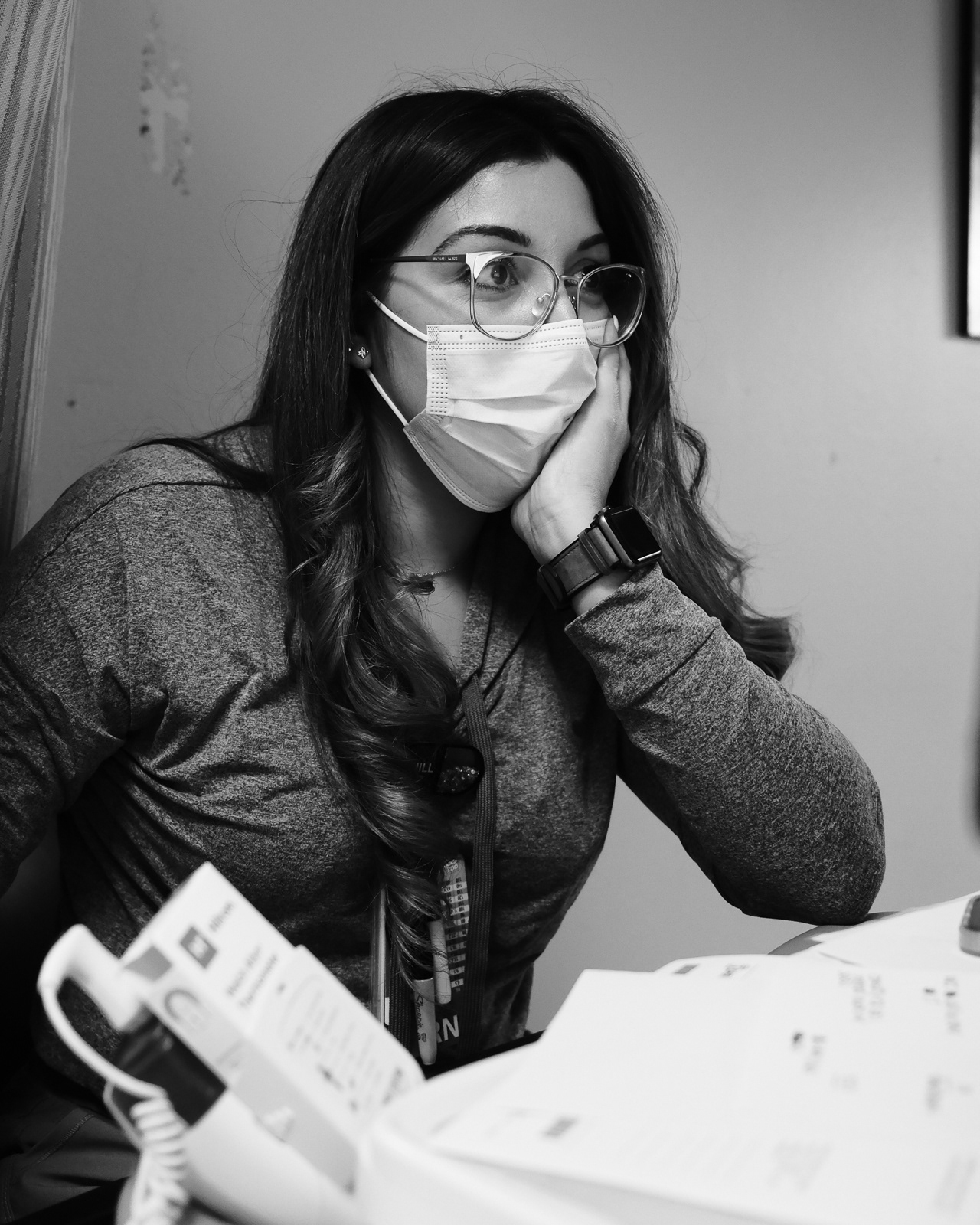 Nurse Cassy attempts to keep up with her charting on a busy day..