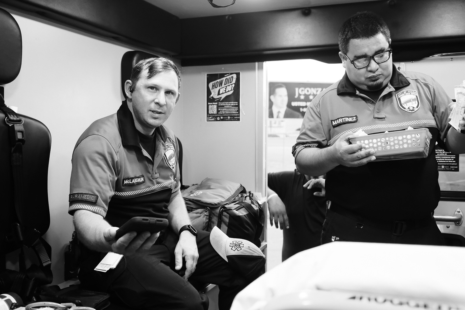Paramedic Eric (left) signs over the narcs during crew change.