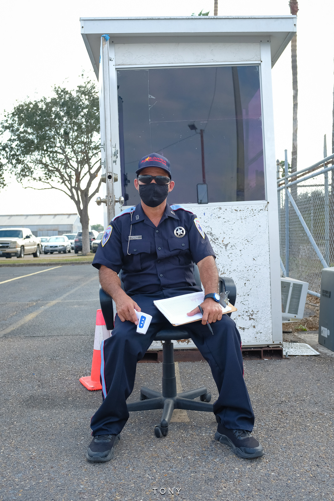 A security guard waits by the gate, McAllen, Texas, November 2020.