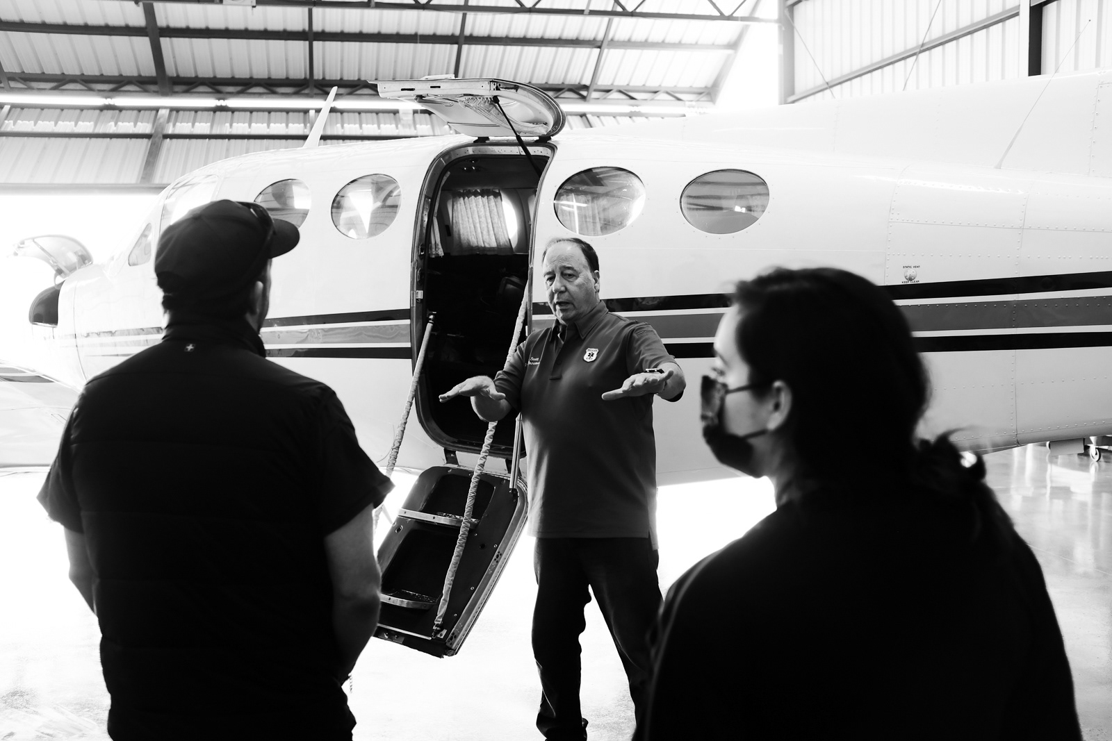 Bill, Chief-Pilot and Paramedic, explaining to the group of flight medics, the proper way to load a patient and equipment into the plane.