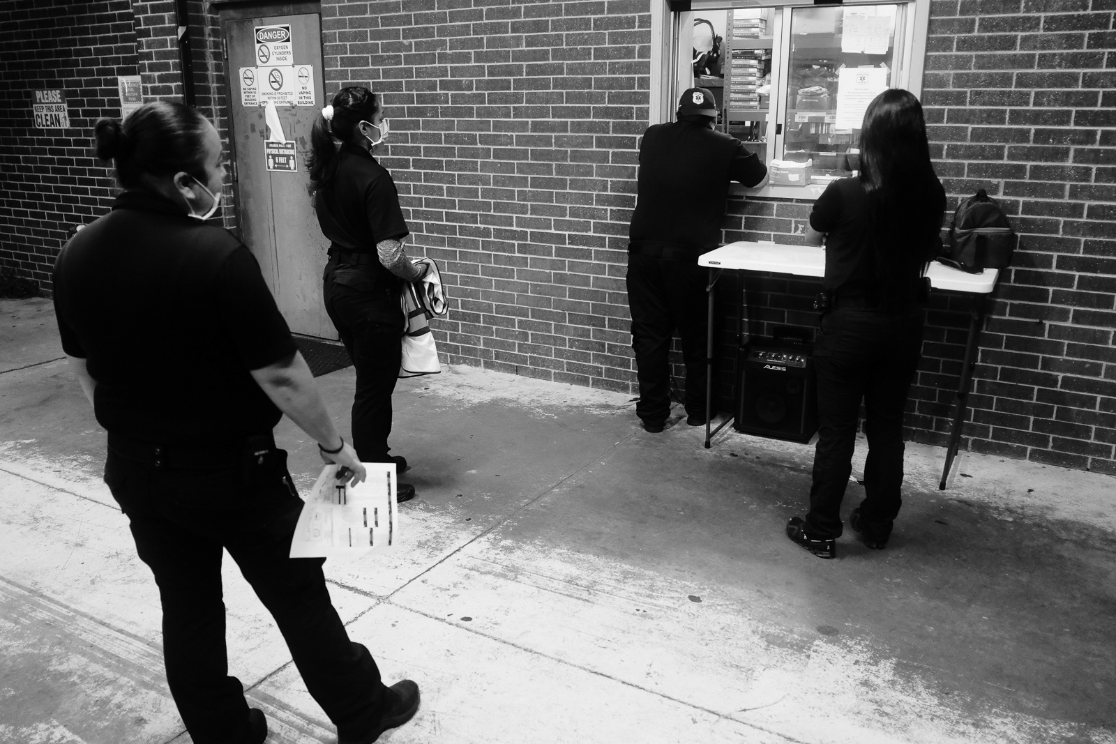 We all wait our tun to turn in our check off sheets and then we wait to get our supplies.