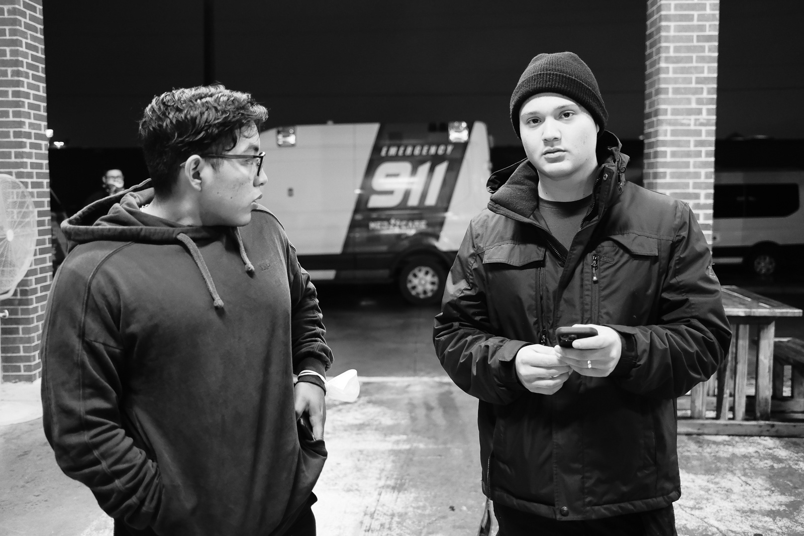 A. Hernandez, EMT, (right), and his partner, E. Valdiviez, EMT, (left) wait for their truck to arrive to start their 24-hour shift. 
