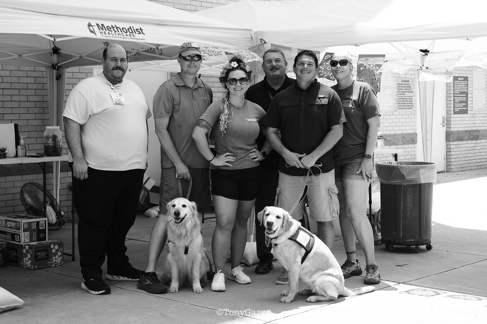 ER personnel giving out food and drinks to EMS personnel. 