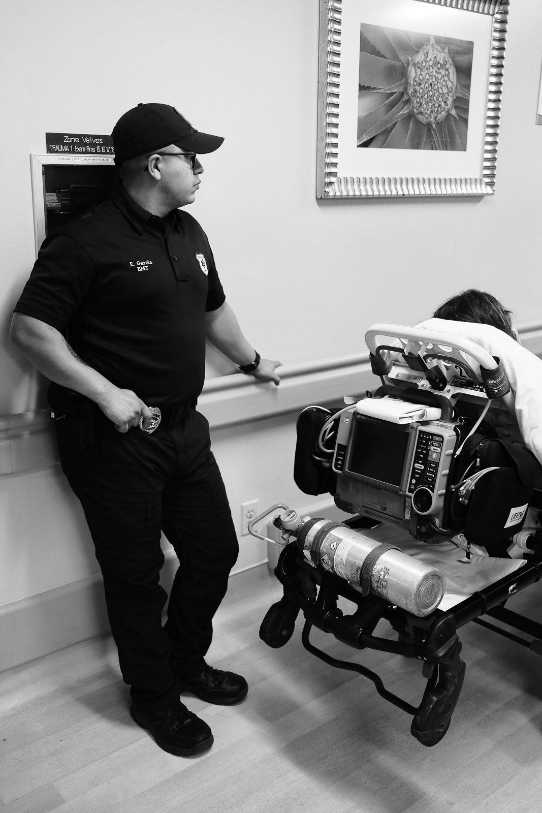 E. Garcia, EMT, waiting with the patient at the EMS line. 