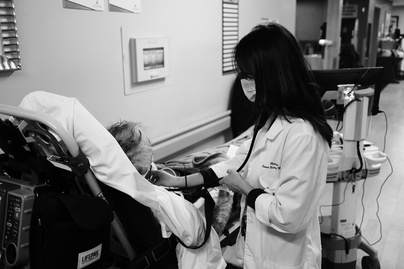 ER PA checks patients lungs coming in for shorthness of breathe.
